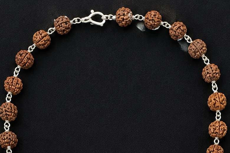 The clasp and the smaller beads at the back of the mala