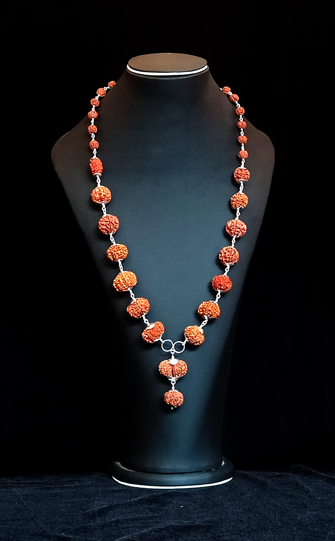 The centre bead and the drop at the front of the mala